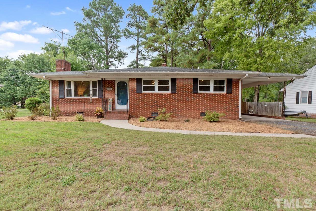 2702 Richwood Road Durham, NC 27705 - Photo 27 of 31 a front view of house with yard and green space