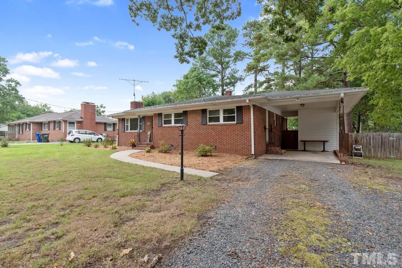 2702 Richwood Road Durham, NC 27705 - Photo 28 of 31 a view of a house with a backyard