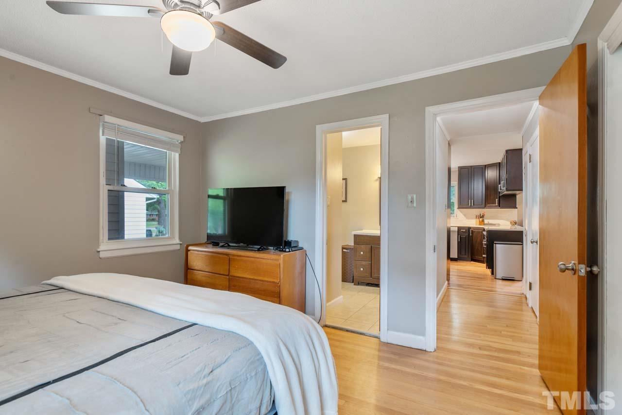 2702 Richwood Road Durham, NC 27705 - Photo 10 of 31 a bedroom with a bed and a flat screen tv