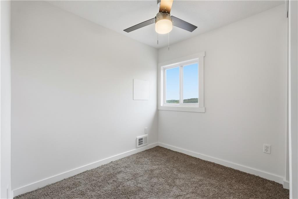 480 Songo Street Pittsburgh, PA 15227 - Photo 23 of 36 an empty room with a window and ceiling fan