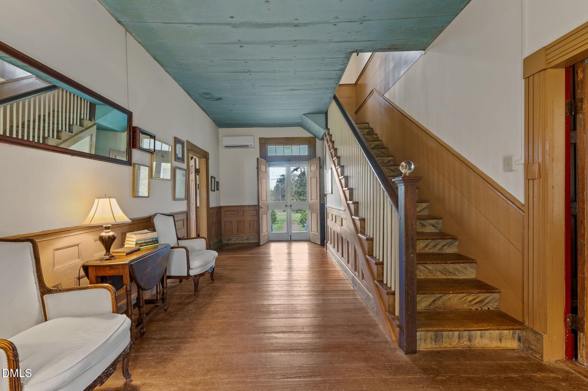 6720 Mebane Oaks Road Mebane, NC 27302 - Photo 8 of 85 a view of entryway and hall with wooden floor