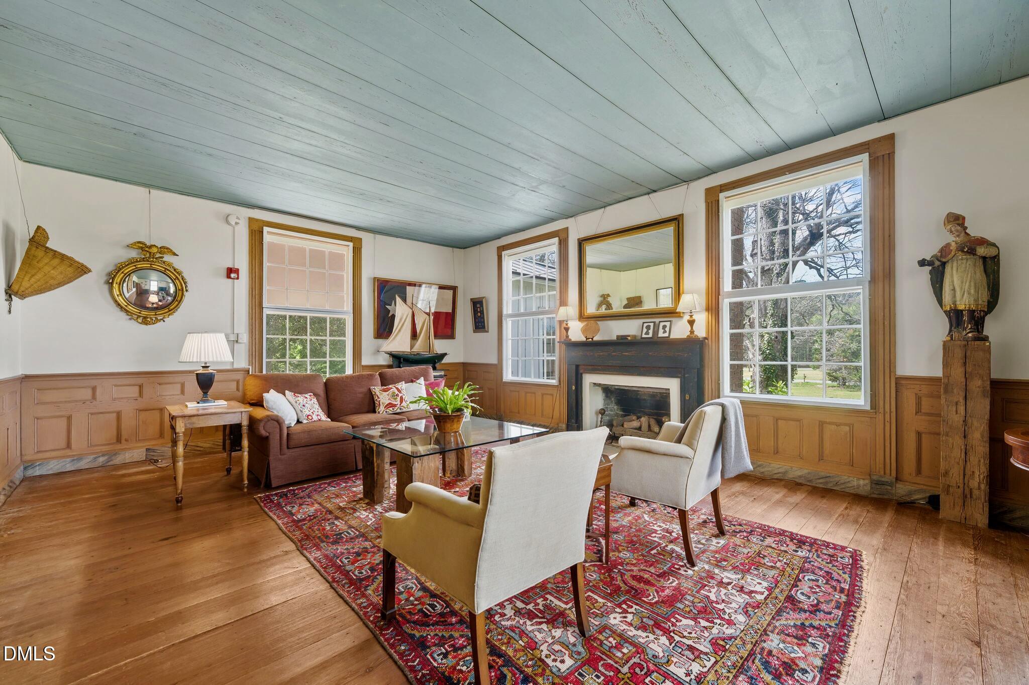 6720 Mebane Oaks Road Mebane, NC 27302 - Photo 12 of 85 a living room with fireplace furniture and a large window