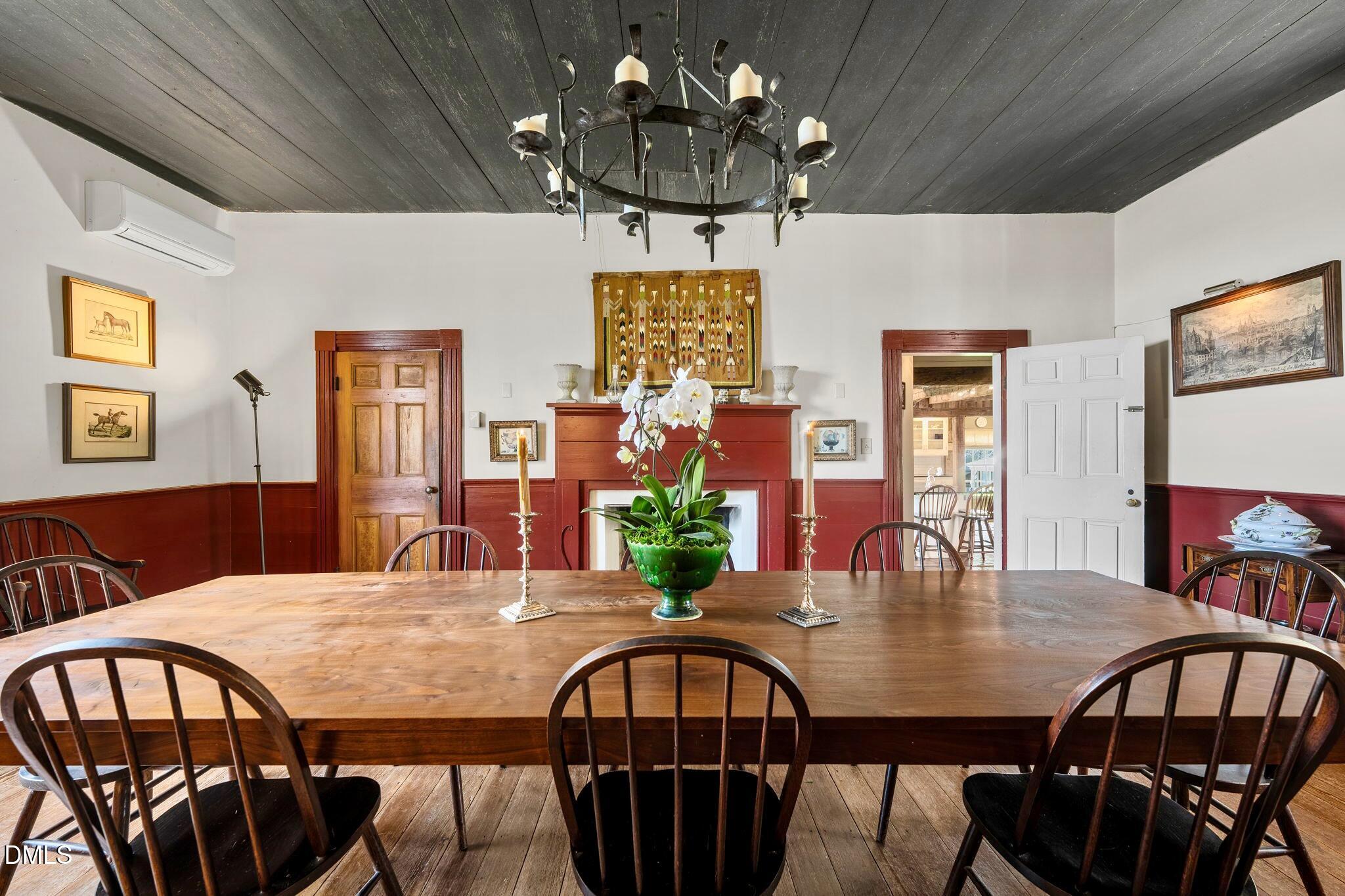 6720 Mebane Oaks Road Mebane, NC 27302 - Photo 13 of 85 a view of a dining room with furniture and chandelier