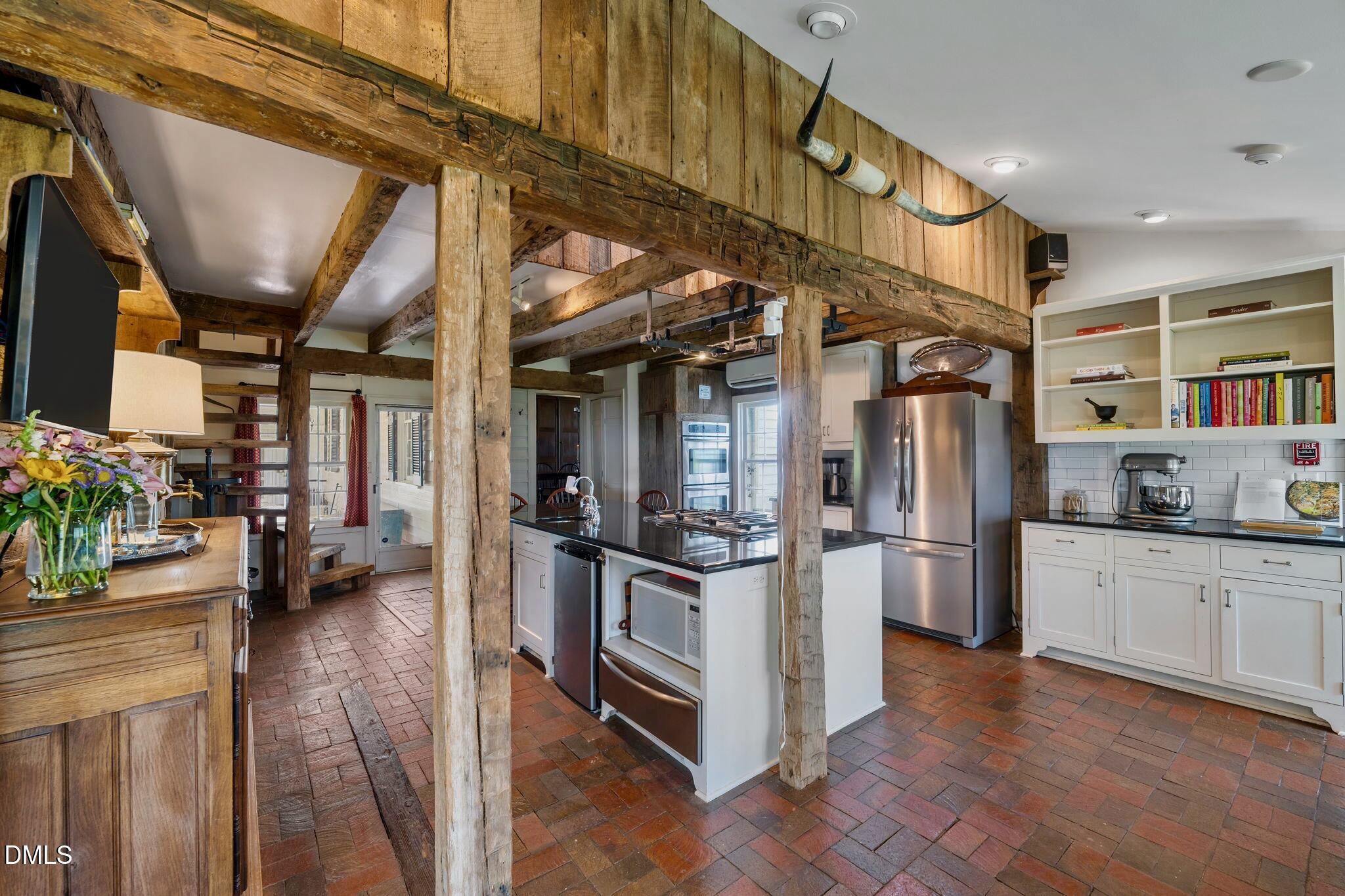 6720 Mebane Oaks Road Mebane, NC 27302 - Photo 20 of 85 a kitchen with stainless steel appliances granite countertop a refrigerator and a stove
