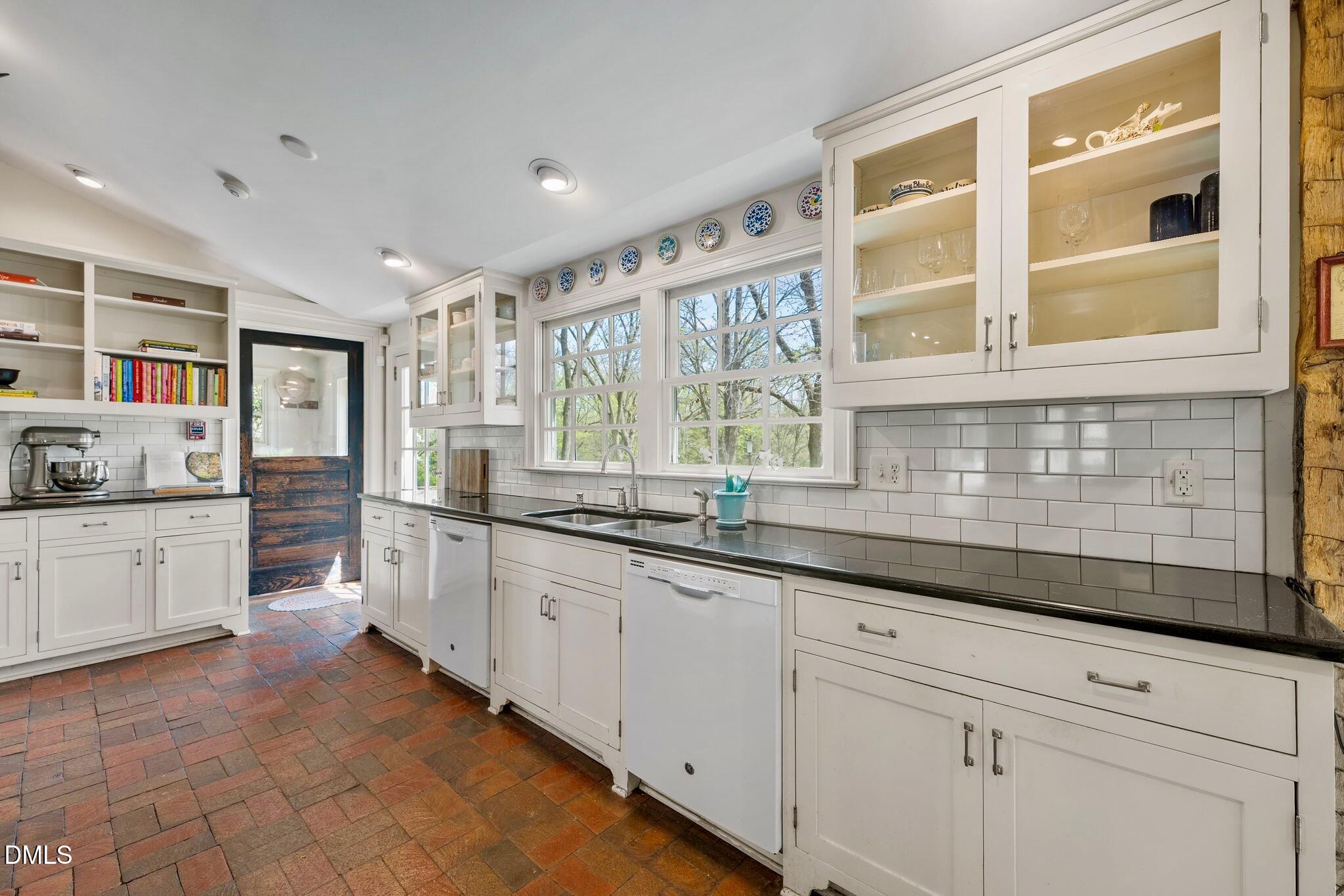 6720 Mebane Oaks Road Mebane, NC 27302 - Photo 21 of 85 a kitchen with granite countertop white cabinets and white appliances