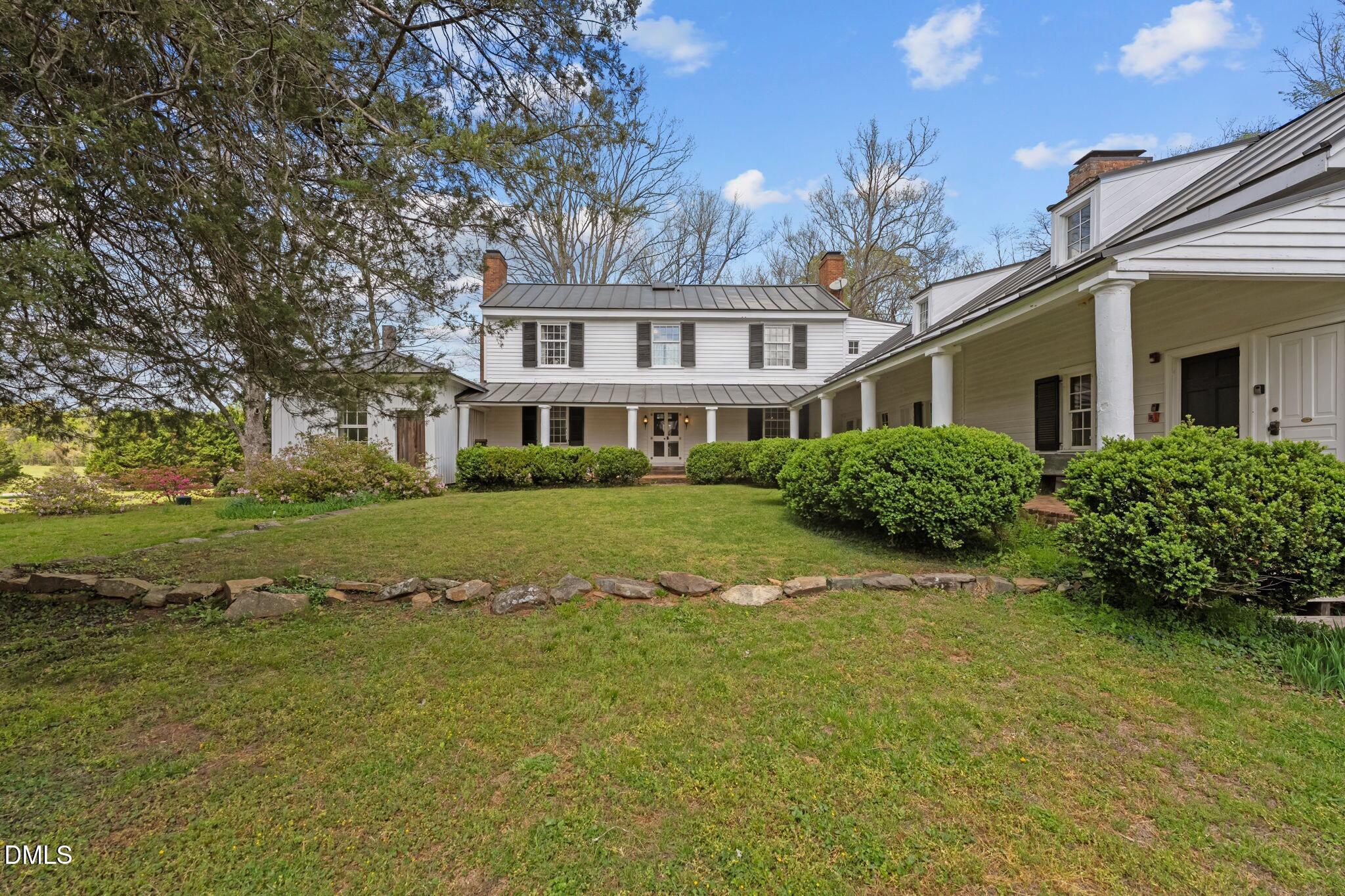 6720 Mebane Oaks Road Mebane, NC 27302 - Photo 2 of 85 a front view of a house with a yard