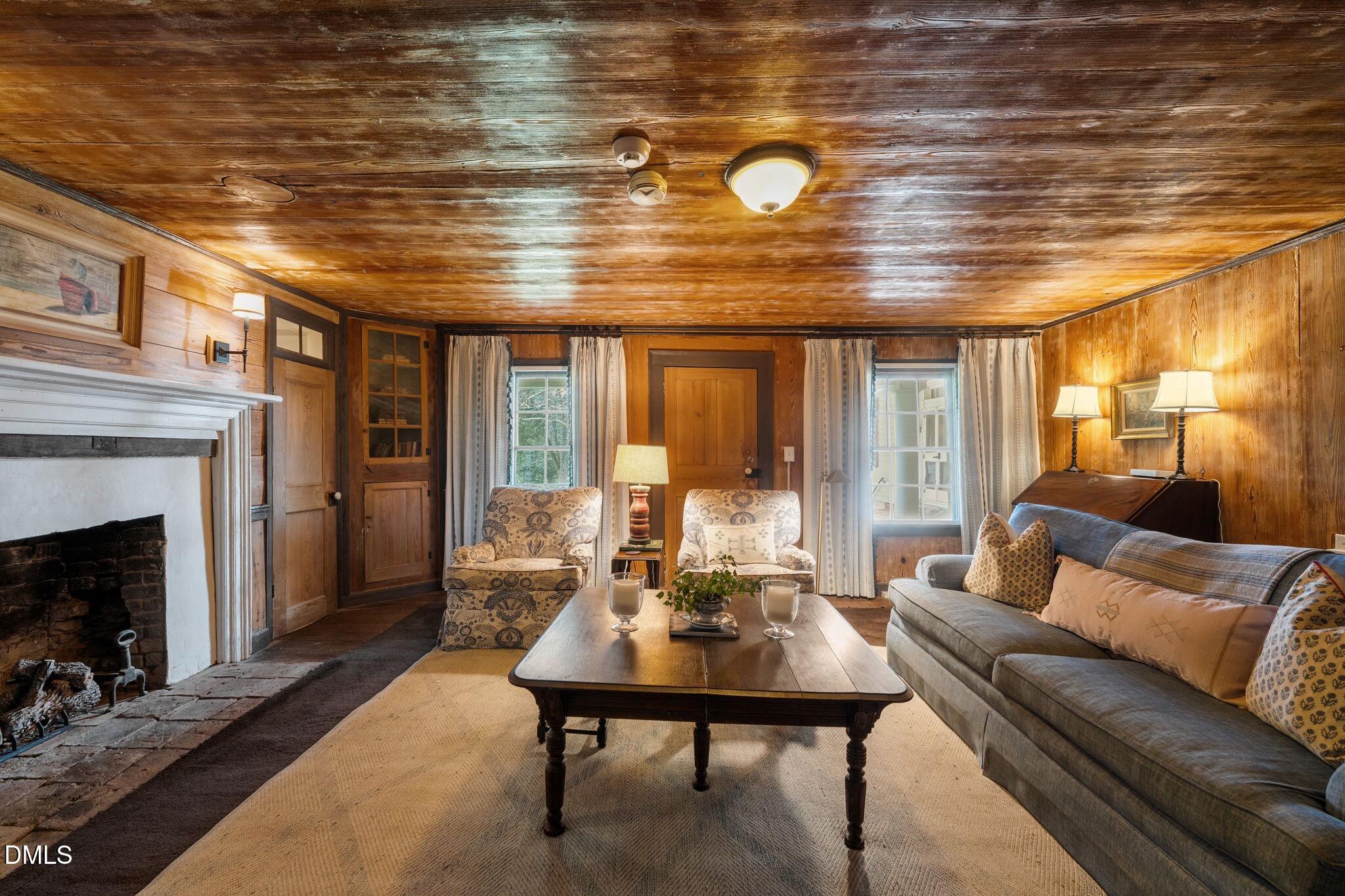 6720 Mebane Oaks Road Mebane, NC 27302 - Photo 31 of 85 a living room with furniture and a fireplace