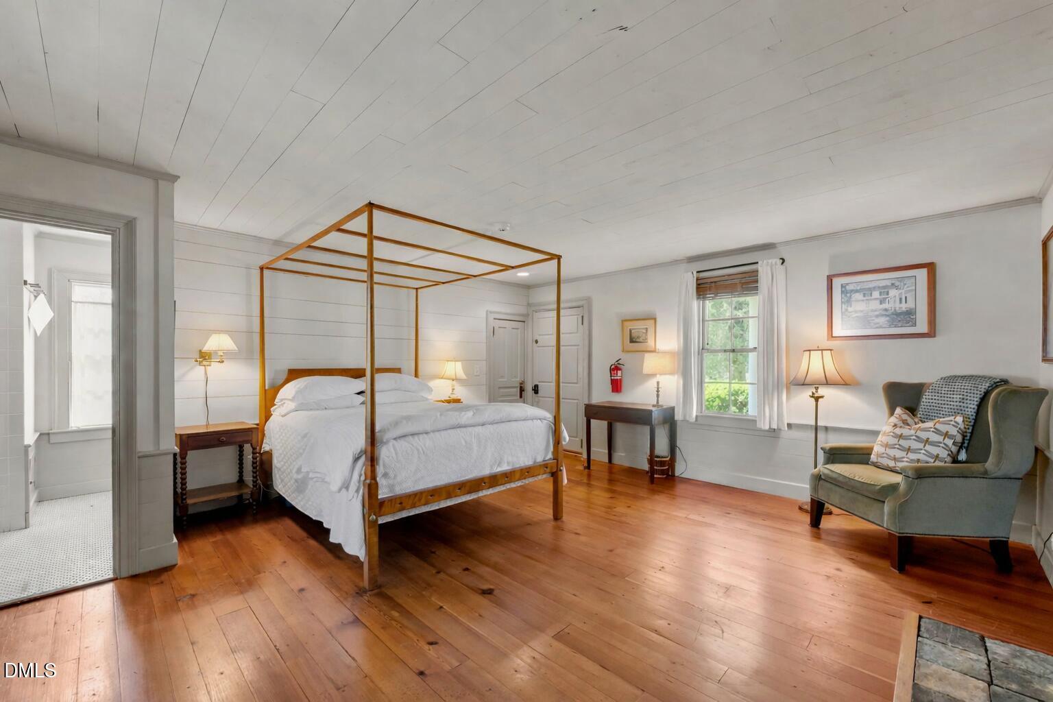 6720 Mebane Oaks Road Mebane, NC 27302 - Photo 35 of 85 a bedroom with a bed and wooden floor