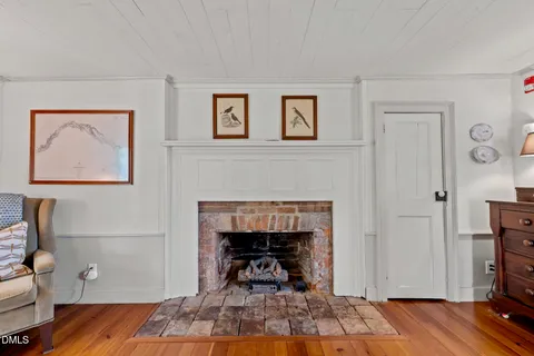 a spacious bedroom with a bed and a fireplace