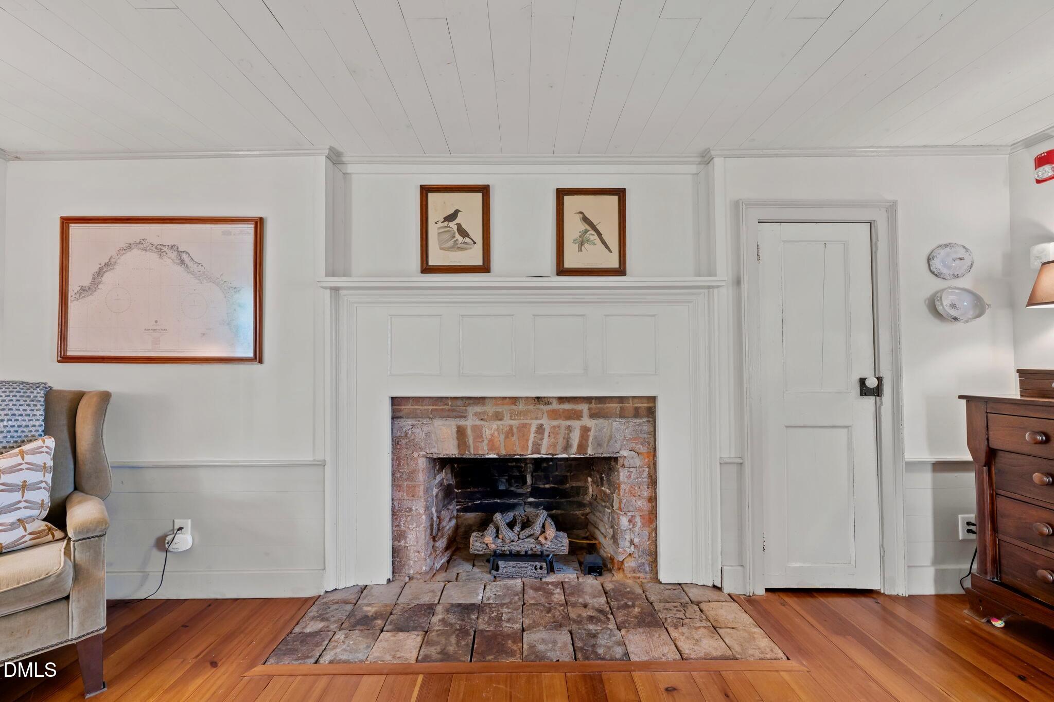 6720 Mebane Oaks Road Mebane, NC 27302 - Photo 36 of 85 a living room with furniture and a fireplace