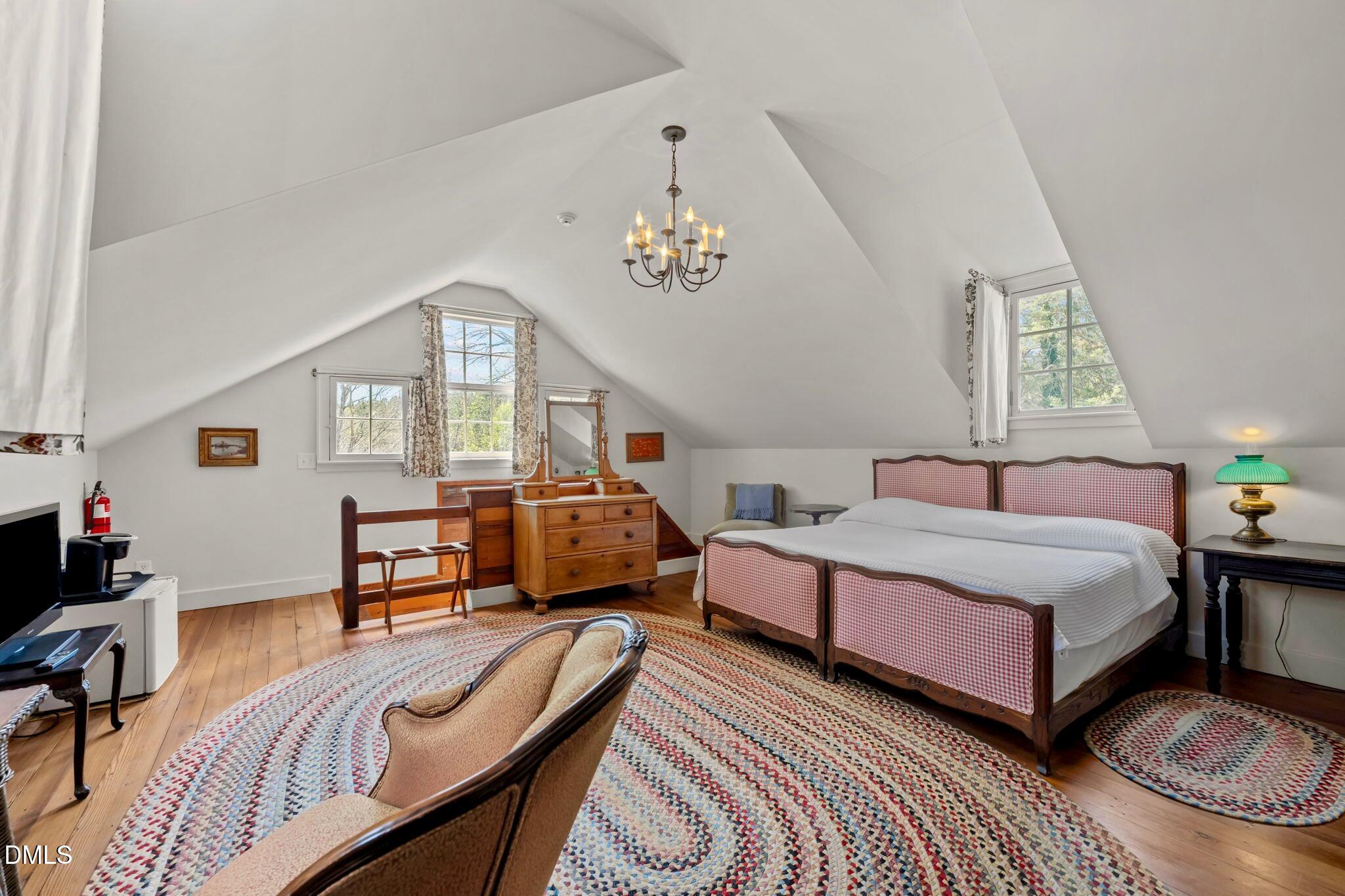 6720 Mebane Oaks Road Mebane, NC 27302 - Photo 42 of 85 a bedroom with a bed couch and a window