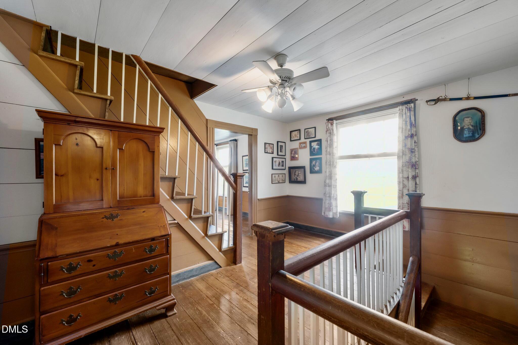 6720 Mebane Oaks Road Mebane, NC 27302 - Photo 46 of 85 a view of an entryway with wooden floor and front door