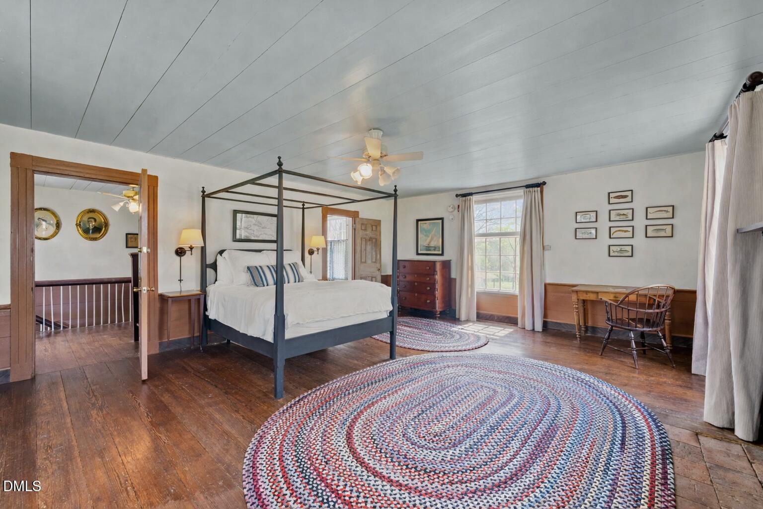 6720 Mebane Oaks Road Mebane, NC 27302 - Photo 48 of 85 a spacious bedroom with a bed and a table