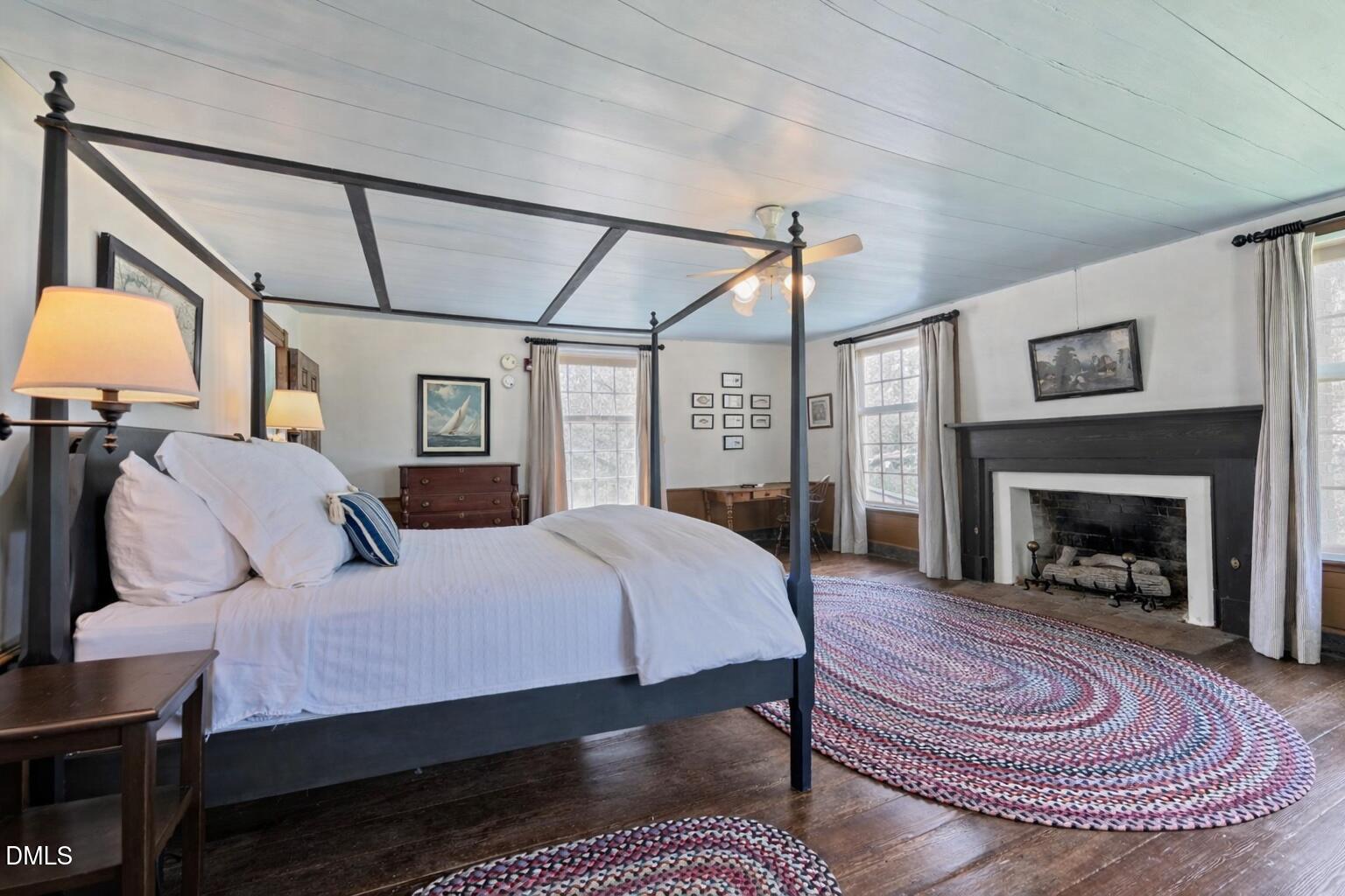 6720 Mebane Oaks Road Mebane, NC 27302 - Photo 49 of 85 a bed room with a bed and a fireplace