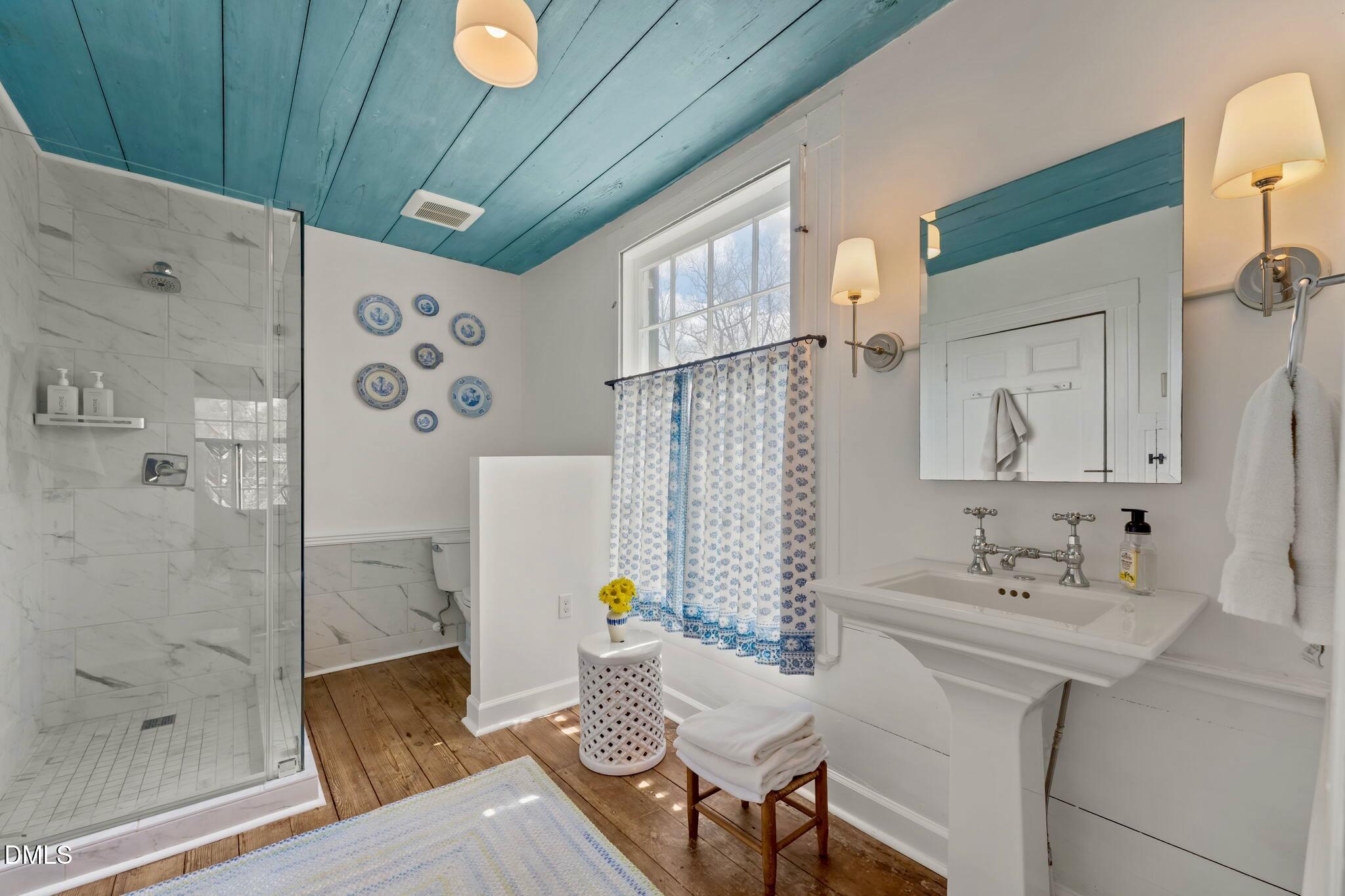 6720 Mebane Oaks Road Mebane, NC 27302 - Photo 51 of 85 a bathroom with a sink and a mirror