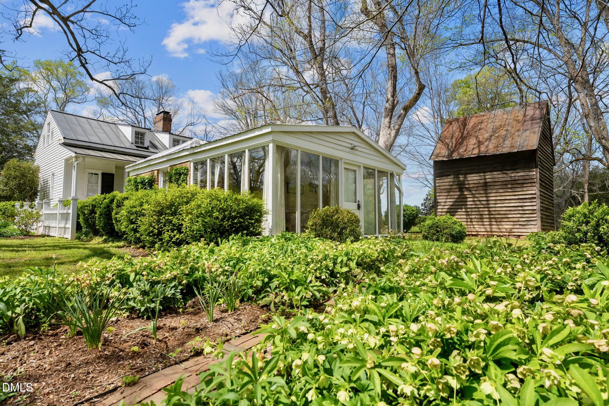 6720 Mebane Oaks Road Mebane, NC 27302 - Photo 57 of 85 a front view of a house with a garden