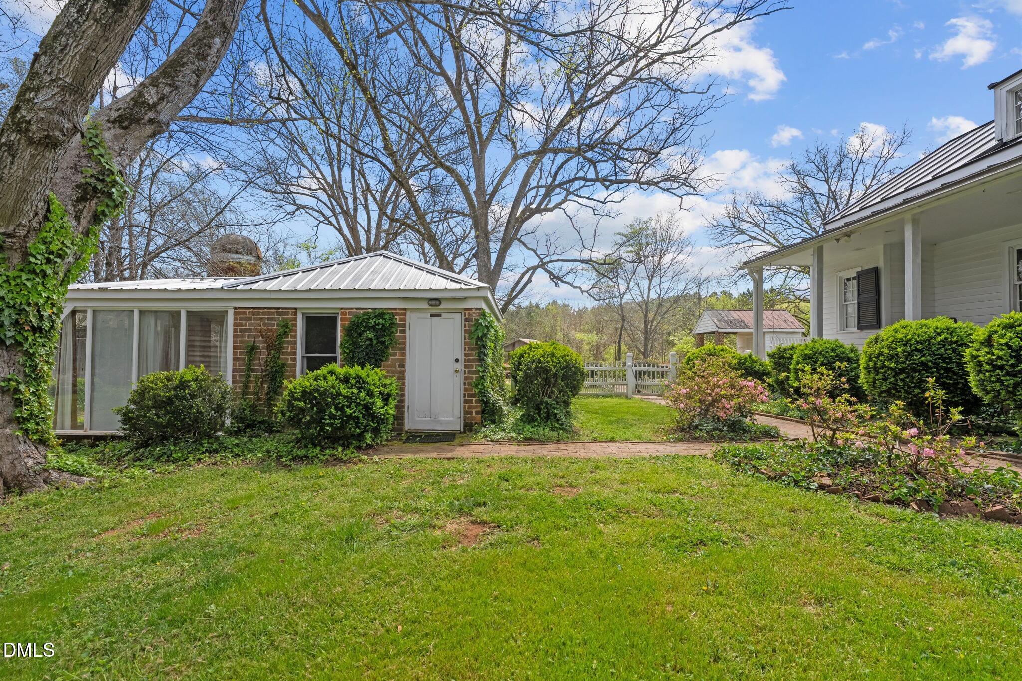6720 Mebane Oaks Road Mebane, NC 27302 - Photo 58 of 85 a front view of a house with a yard