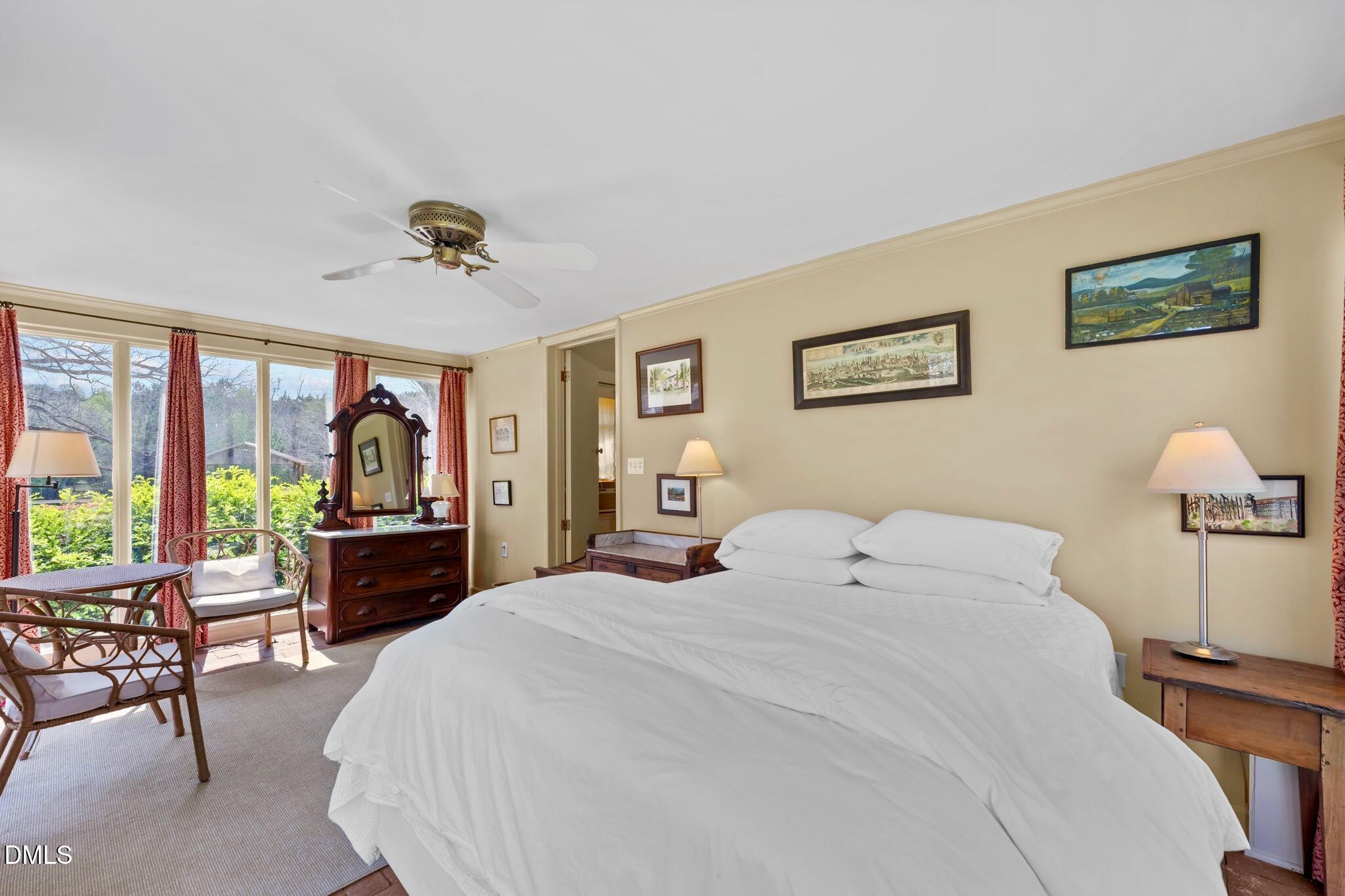 6720 Mebane Oaks Road Mebane, NC 27302 - Photo 60 of 85 a bedroom with a large bed and a large window