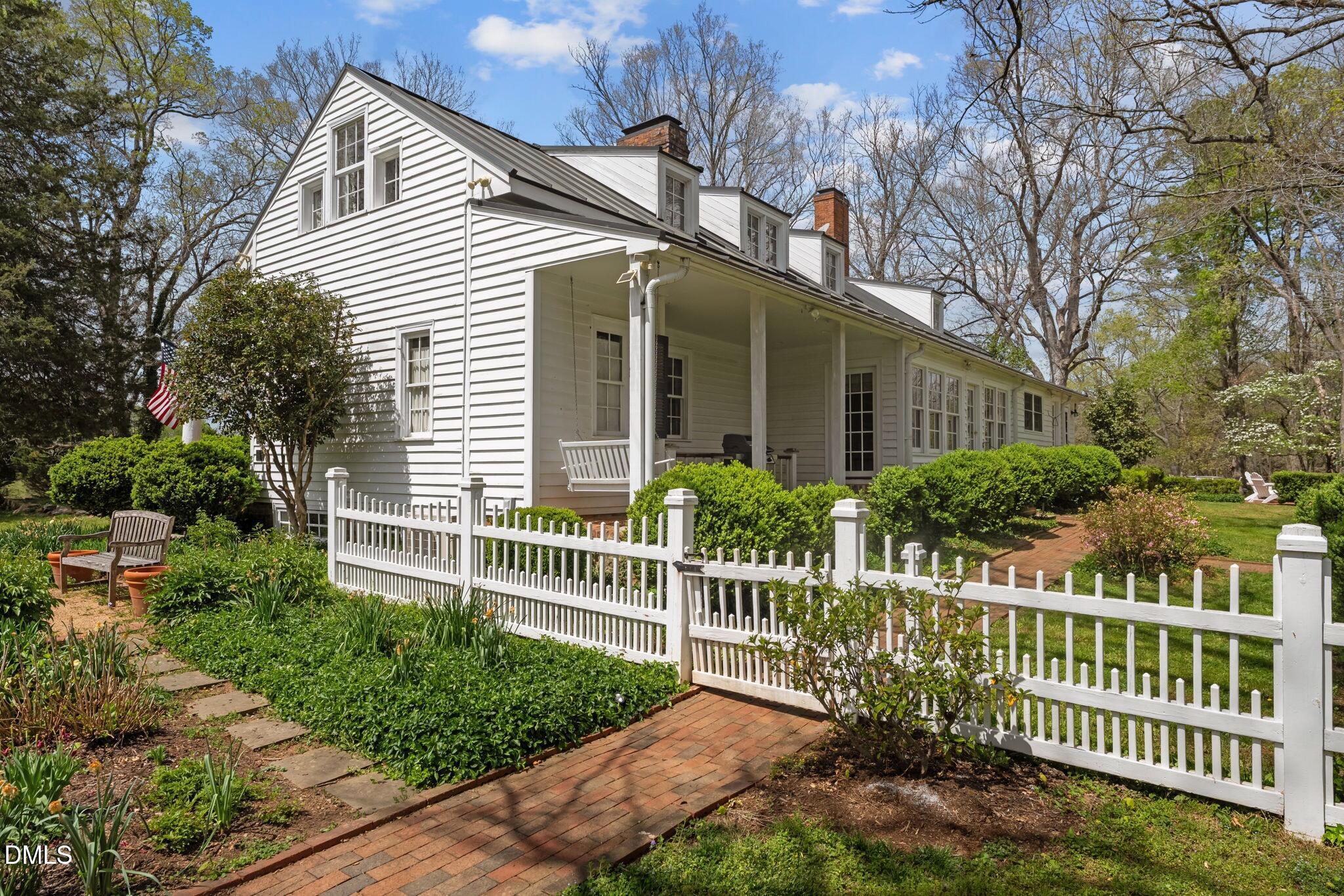 6720 Mebane Oaks Road Mebane, NC 27302 - Photo 63 of 85 a view of a house with a small yard and wooden fence
