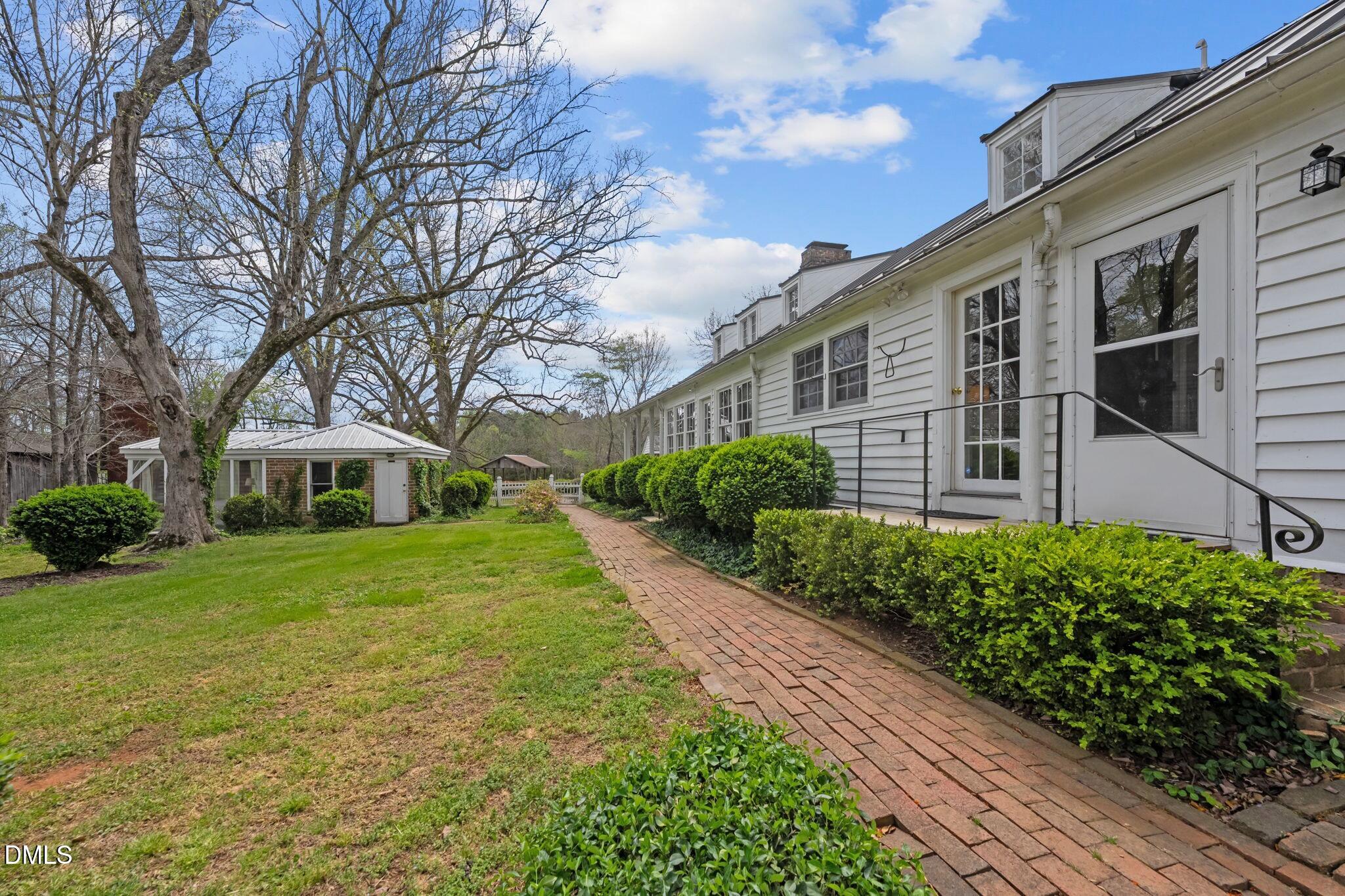6720 Mebane Oaks Road Mebane, NC 27302 - Photo 65 of 85 a front view of a house with a yard