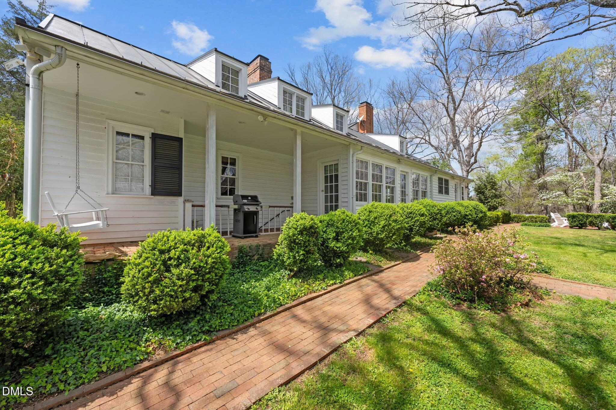 6720 Mebane Oaks Road Mebane, NC 27302 - Photo 66 of 85 a front view of house and yard with green space