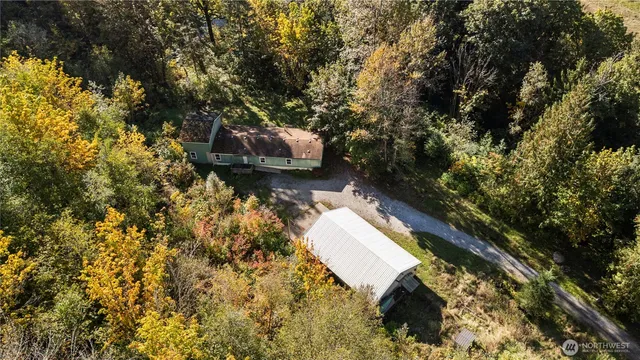 a view of a backyard with a small cabin