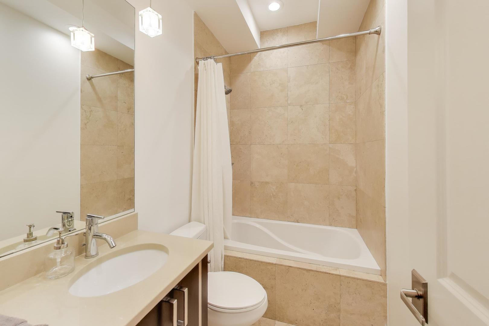 822 West Buckingham Place, Unit 301 Chicago, IL 60657 - Photo 15 of 26 a bathroom with a sink toilet and shower