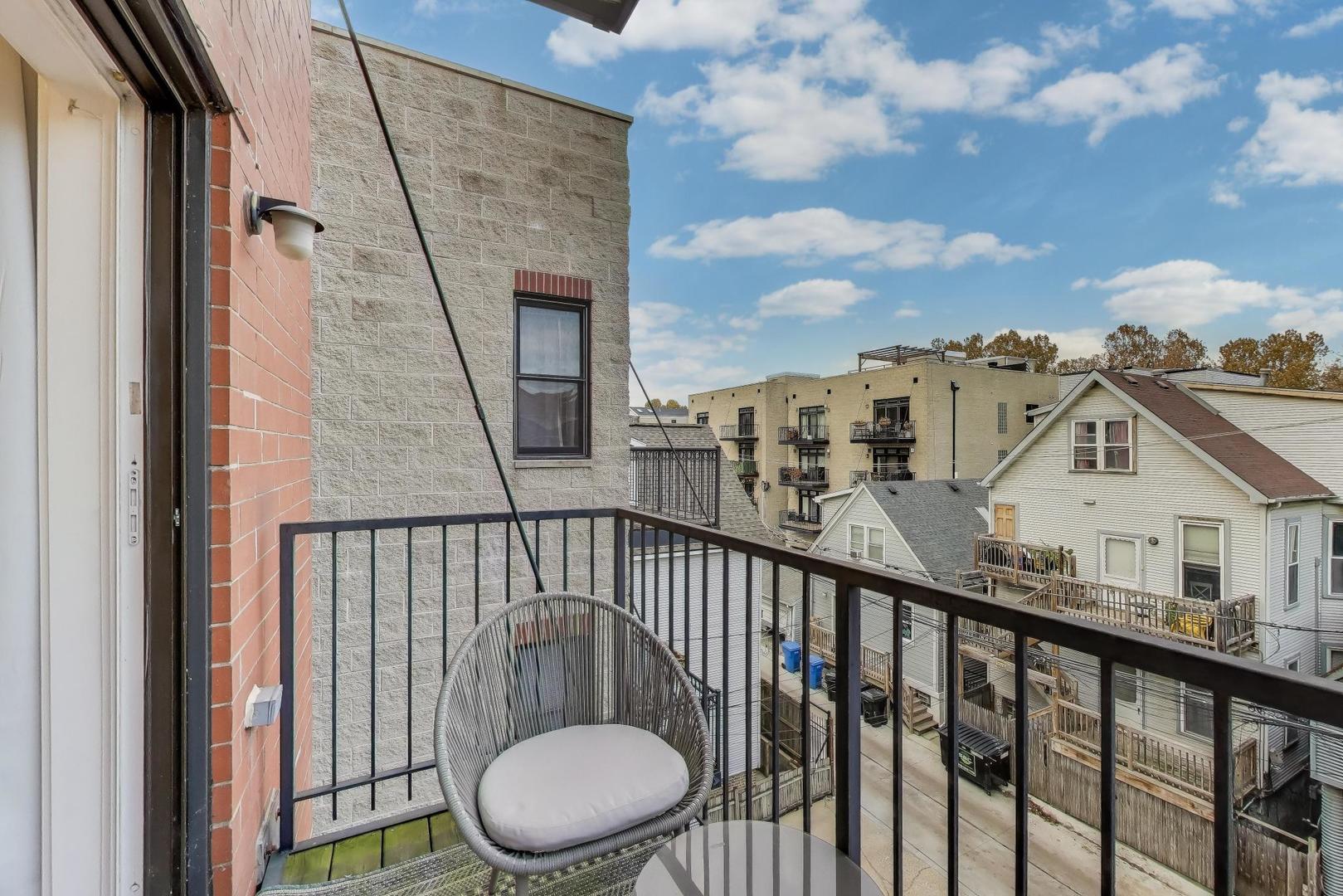 822 West Buckingham Place, Unit 301 Chicago, IL 60657 - Photo 18 of 26 a view of a balcony with wooden floor