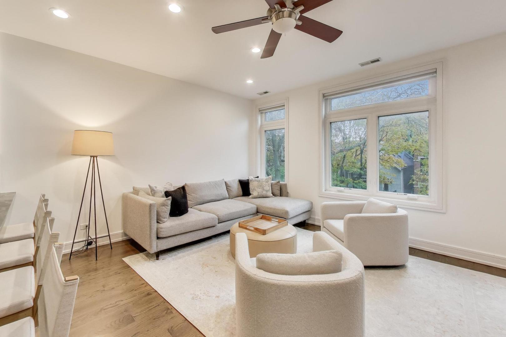 822 West Buckingham Place, Unit 301 Chicago, IL 60657 - Photo 2 of 26 a living room with furniture and a large window