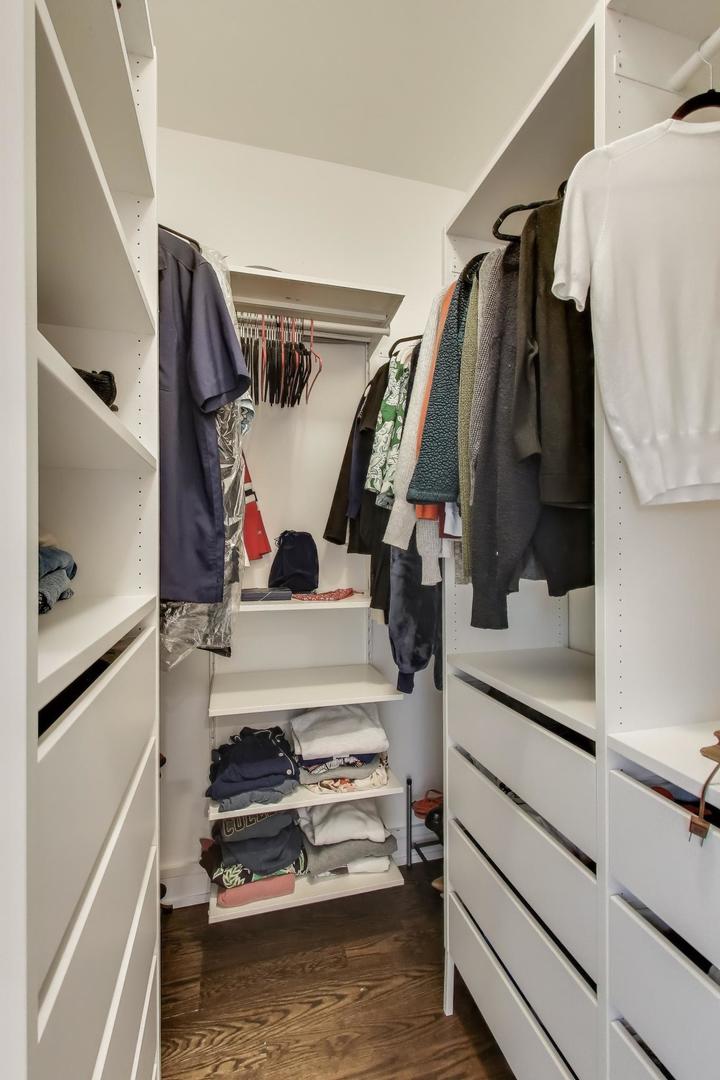 822 West Buckingham Place, Unit 301 Chicago, IL 60657 - Photo 10 of 26 a view of walk in closet with clothes and shoes