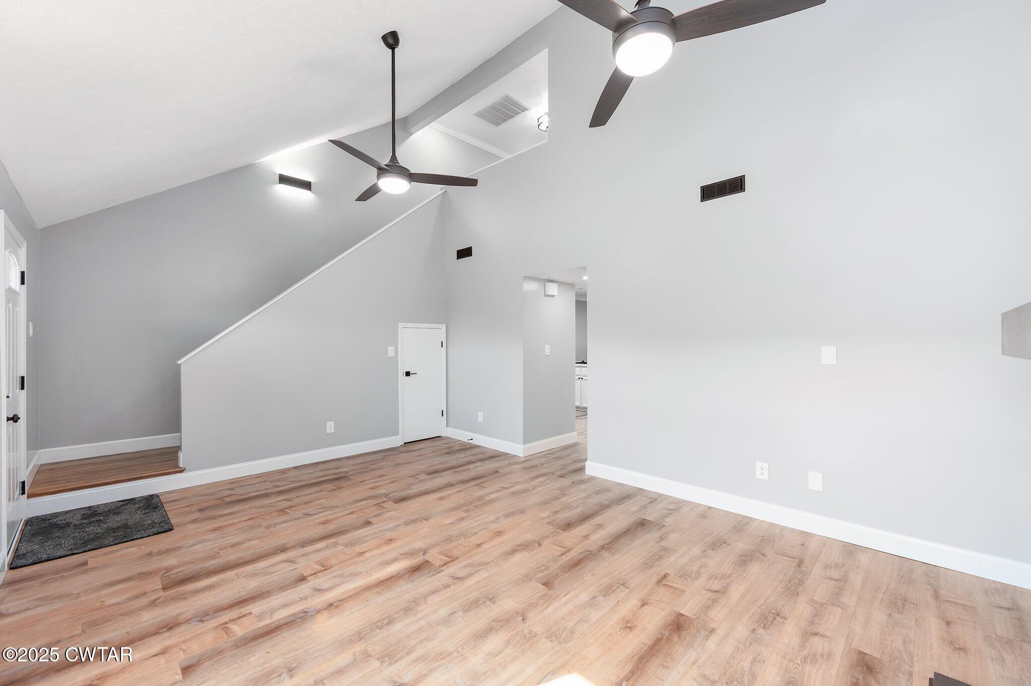 669 Walker Road Jackson, TN 38305 - Photo 6 of 32 a view of an empty room with a chandelier fan