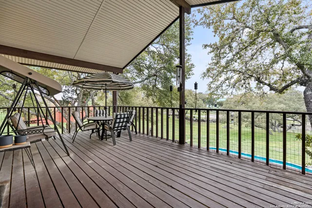 a view of balcony with wooden floor