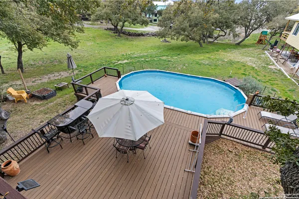 an outdoor space with furniture and garden