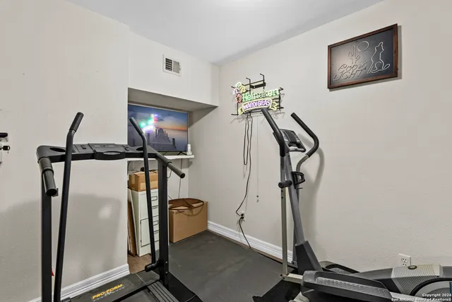 a view of a room with gym equipment