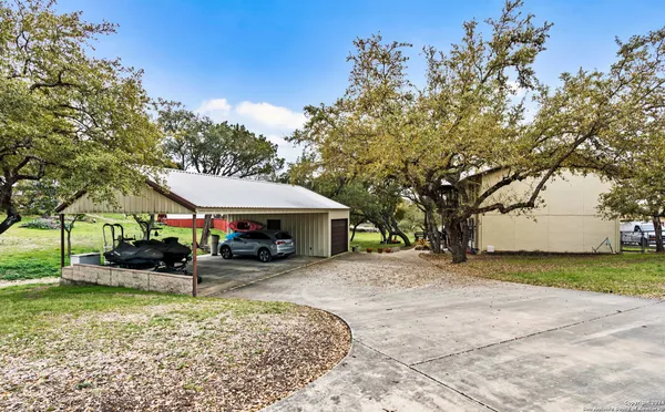 an outdoor view of a house with garden