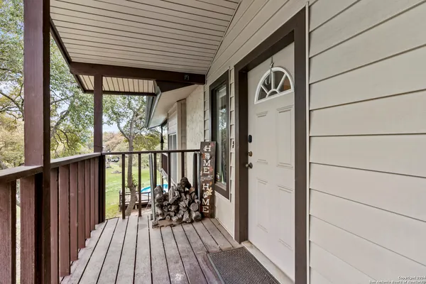 a view of balcony with wooden floor