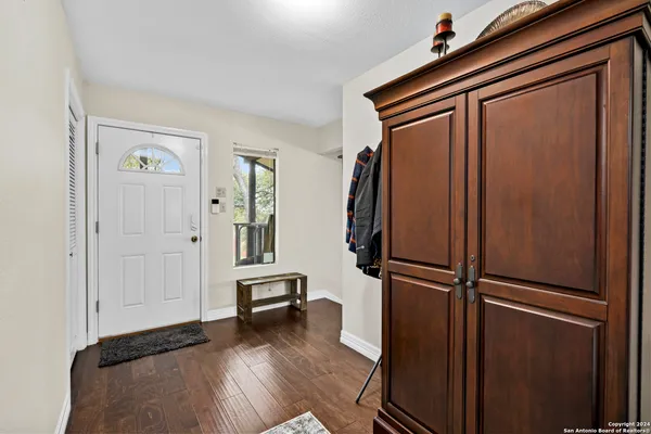 a view of front door with wooden floor