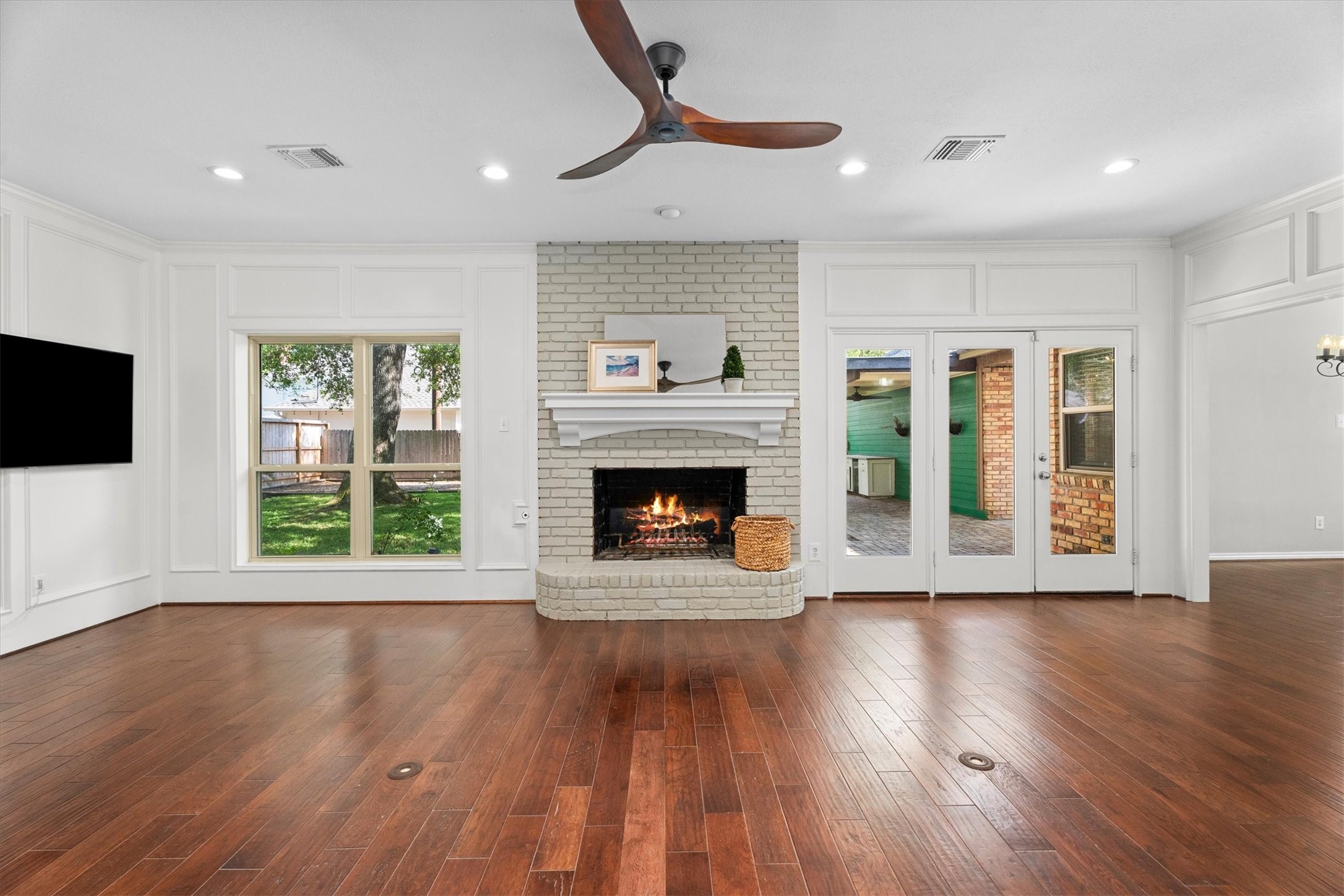 16267 Salmon Lane Spring, TX 77379 - Photo 15 of 48 The spacious, open family room is the heart of this home, anchored by a fireplace and a view of the lush backyard.