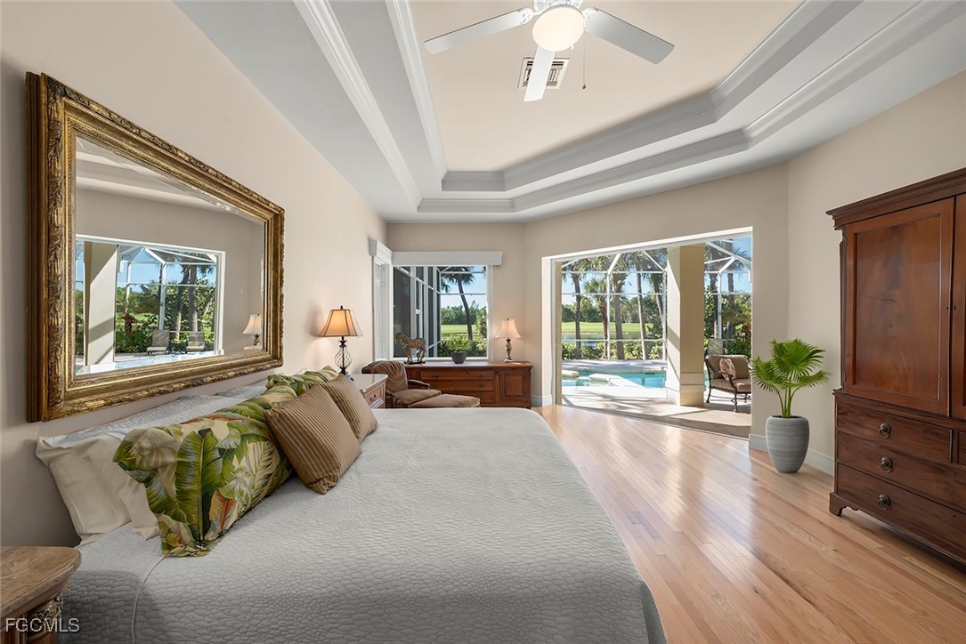 2417 Wulfert Road Sanibel, FL 33957 - Photo 13 of 50 a living room with furniture large windows and wooden floor