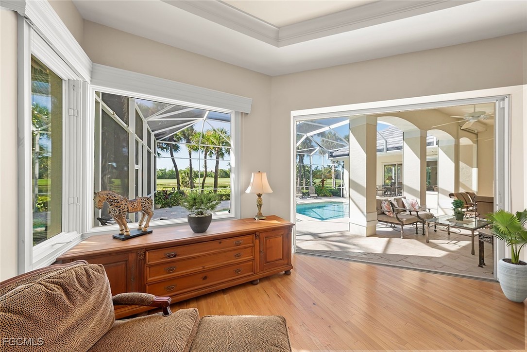 2417 Wulfert Road Sanibel, FL 33957 - Photo 15 of 50 a living room with furniture and floor to ceiling windows