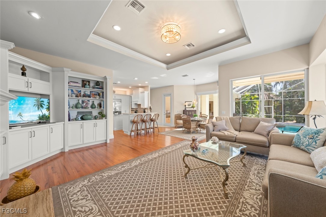 2417 Wulfert Road Sanibel, FL 33957 - Photo 22 of 50 a living room with furniture wooden floor and window