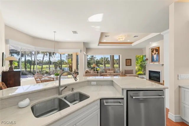 a kitchen with a sink and a refrigerator