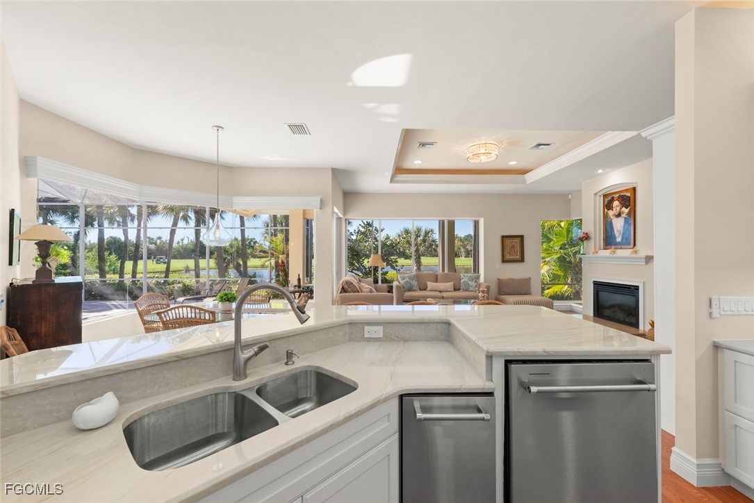2417 Wulfert Road Sanibel, FL 33957 - Photo 24 of 50 a kitchen with a sink and a refrigerator