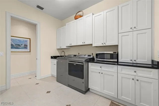 a bedroom with a bed and a potted plant