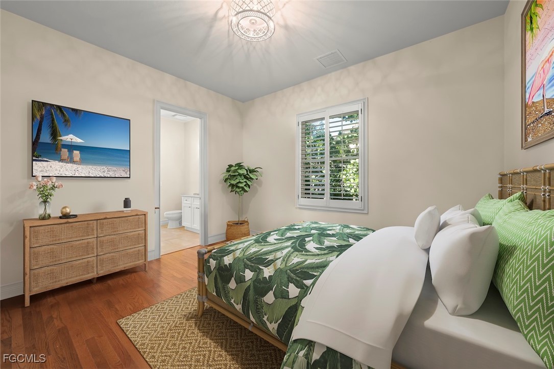 2417 Wulfert Road Sanibel, FL 33957 - Photo 36 of 50 a bedroom with a bed and a dresser