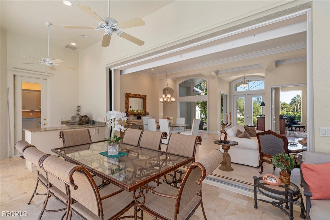 2417 Wulfert Road Sanibel, FL 33957 - Photo 40 of 50 a living room with furniture and a chandelier