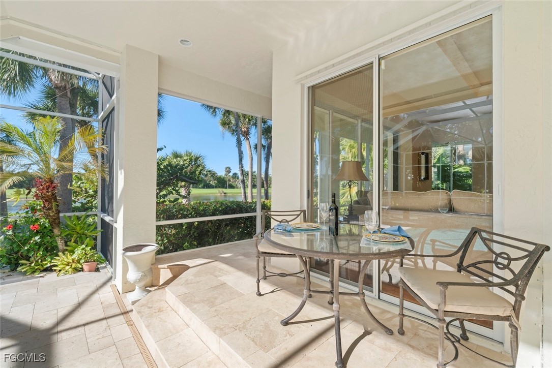 2417 Wulfert Road Sanibel, FL 33957 - Photo 41 of 50 a view of a patio with a table and chairs