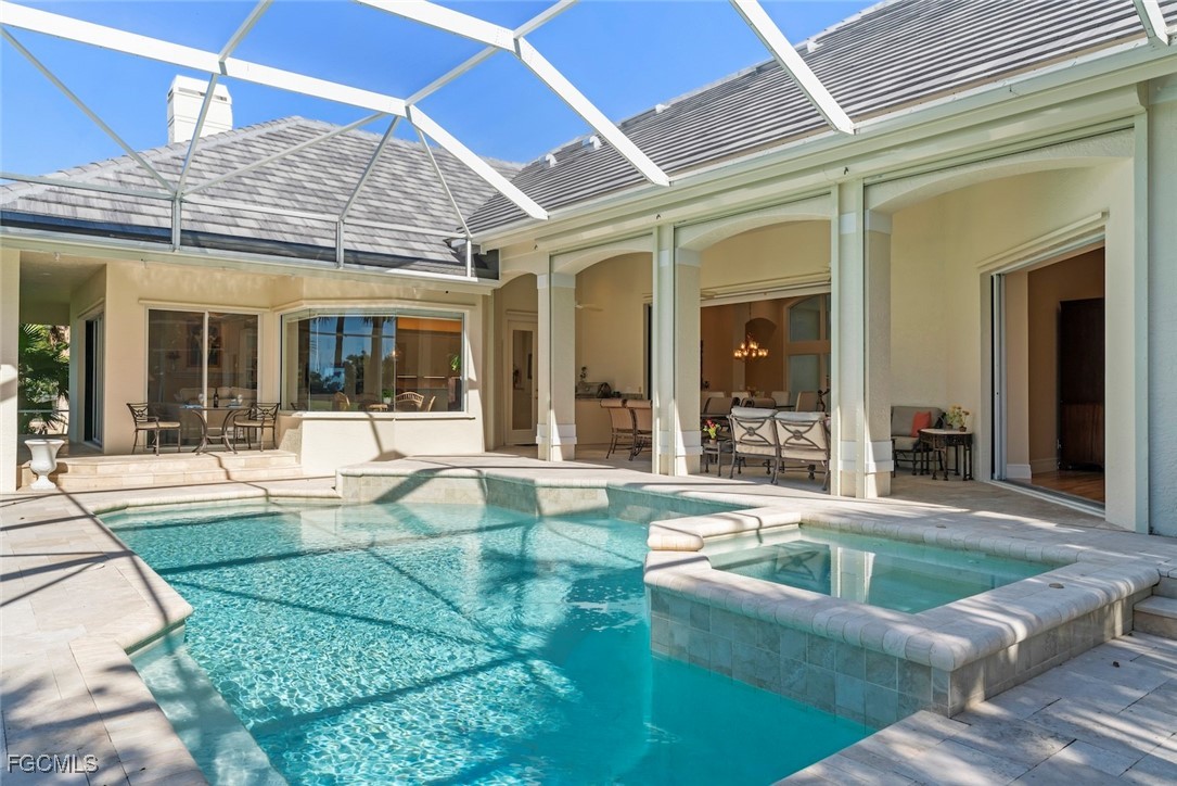 2417 Wulfert Road Sanibel, FL 33957 - Photo 43 of 50 a view of a house with a swimming pool