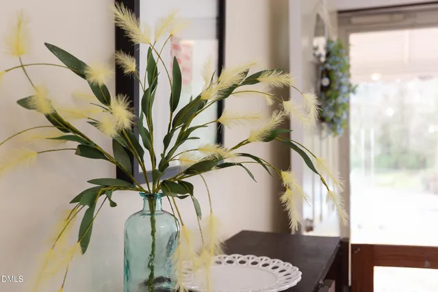 a backyard of a house with yard and outdoor seating