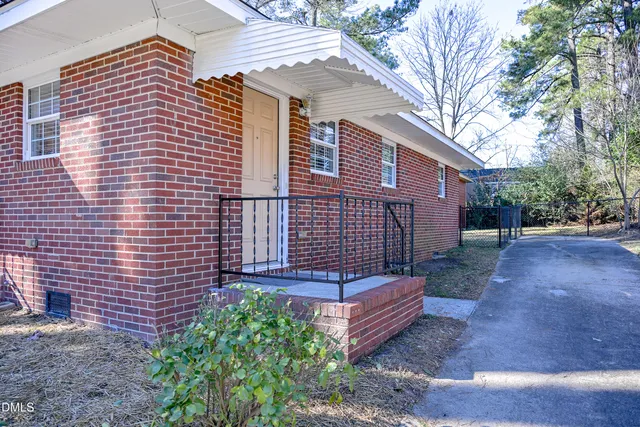 a view of a brick house with a door